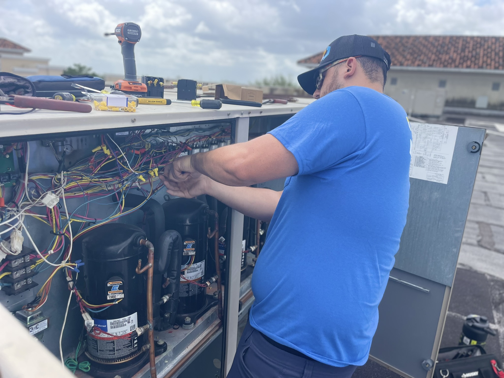 CoolWave technician servicing commercial refrigeration equipment